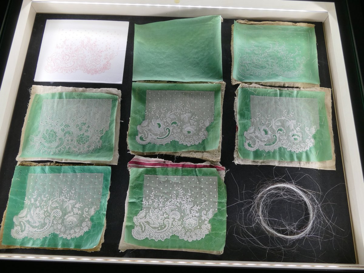 The stages of point d'Alençon at the Alençon lace museum — one motif progressing from inked parchment to finished lace.