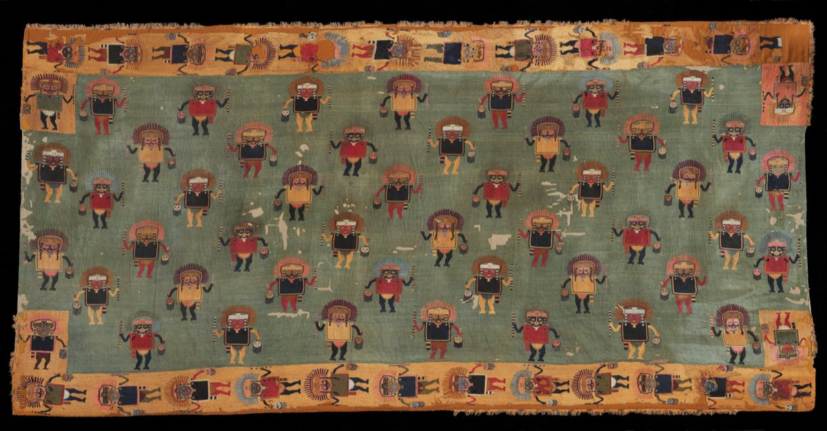 An embroidered Paracas ceremonial mantle, around 2,000 years old, preserved by Peru's desert coast.